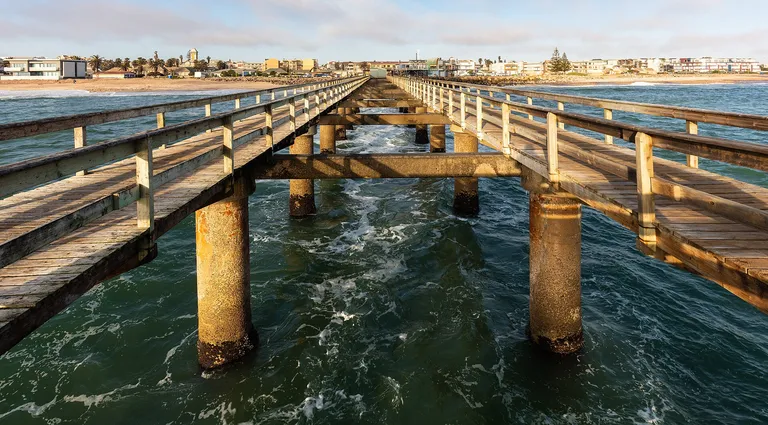 The wooden jetty reaching into the Atlantic at Swakopmund, Namibia