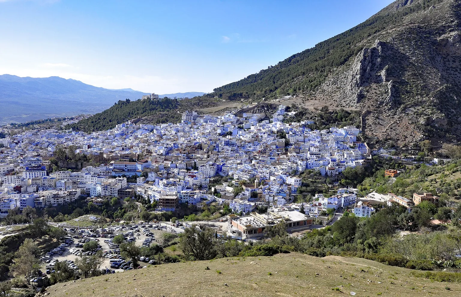 Blue-washed Chefchaouen beneath the Rif Mountains in Morocco