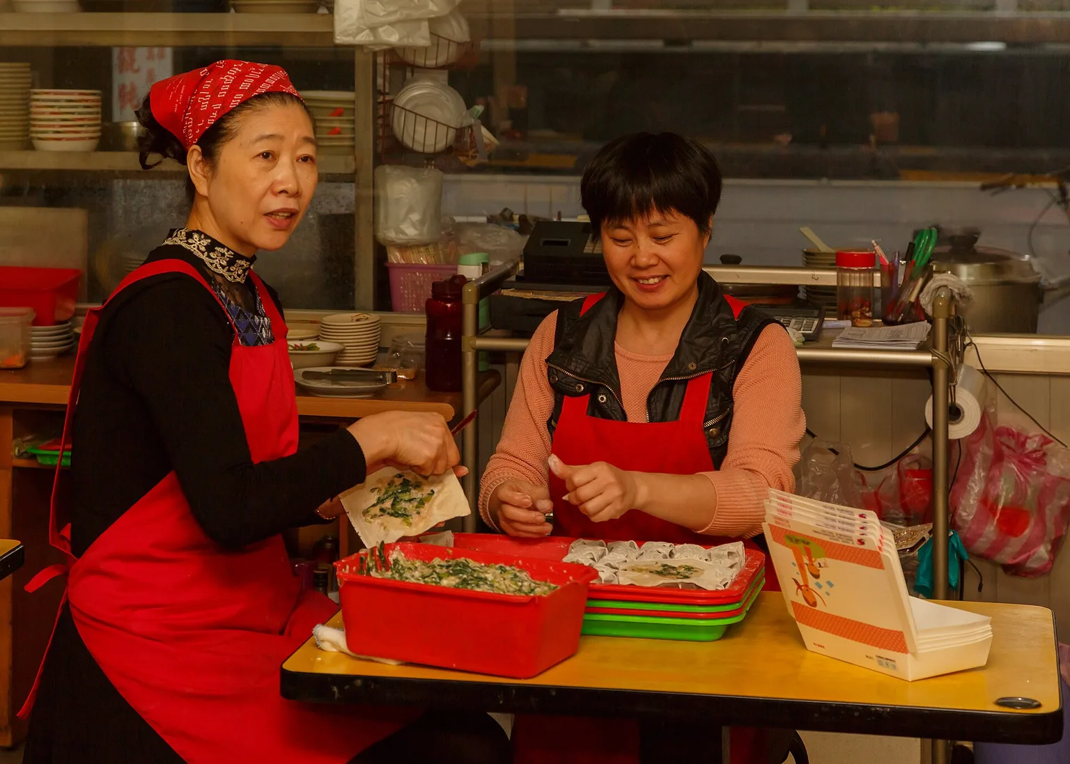 Two cooks preparing food at a Taipei restaurant in Taiwan